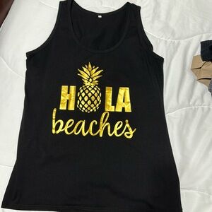 Black tank top for women. Large.  Says Hola Beaches in gold.  Never worn.